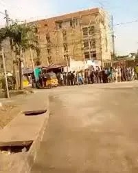 Economic hardship: Trending video of Nigerians filing out to receive loaves of bread and bible from a missionary in Lagos