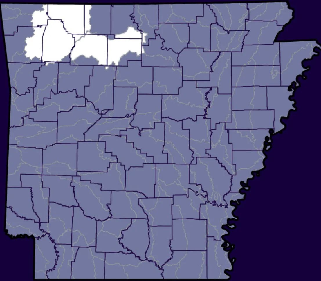 A map of Arkansas highlighting several counties in the northwestern region in white, while the rest of the counties are shaded in purple. The county borders and major rivers are visible.