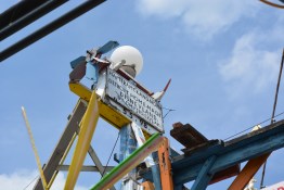 The sign high atop the exhibition.