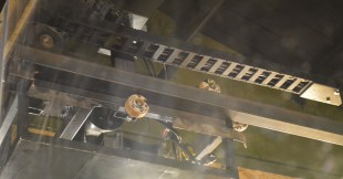 The claw rides along a fairly standard steel track, using skateboard bearings