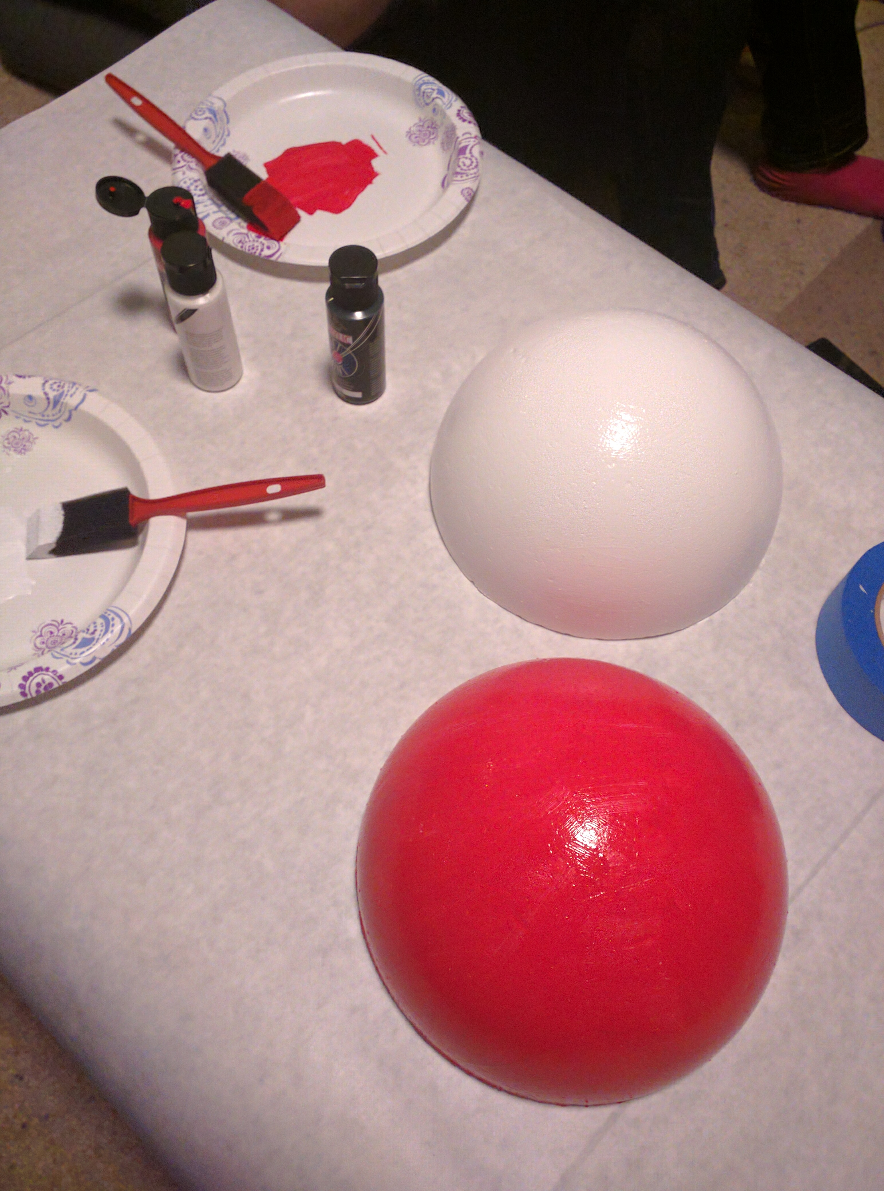 Acrylic paint turns the styrofoam into a Pokéball