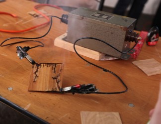 Making Lichtenberg figures in a piece of wood with a transformer