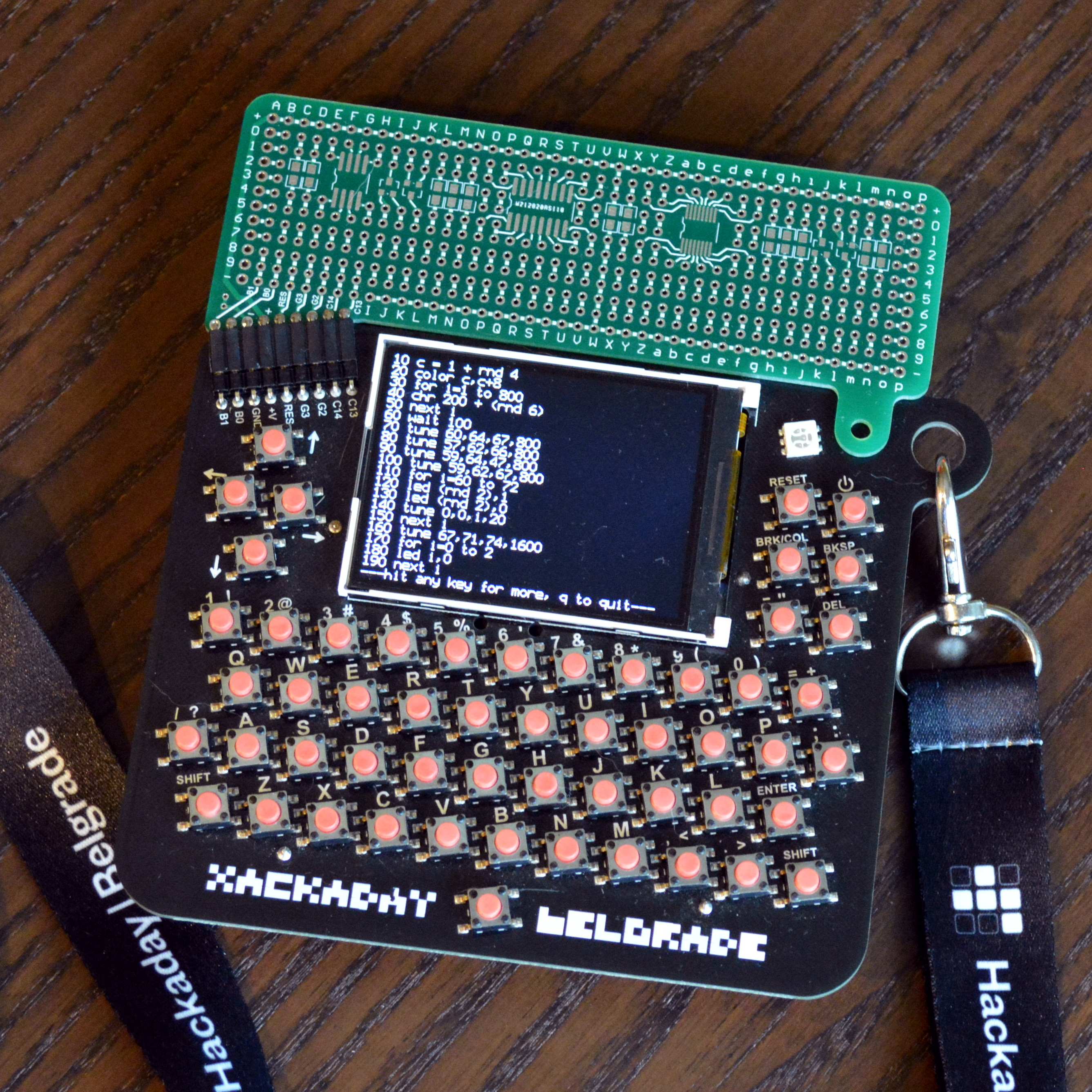Hackaday Belgrade badge with hardware breakout prototype (production will be black)
