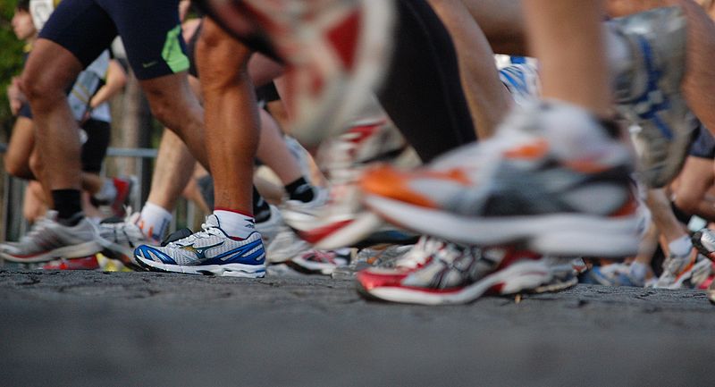 An image of running shoes in a marathon.
