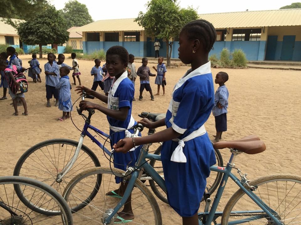 Gambian children use the donated bikes to travel to school. (Credit: Hackney Volunteer Police Cadets)
