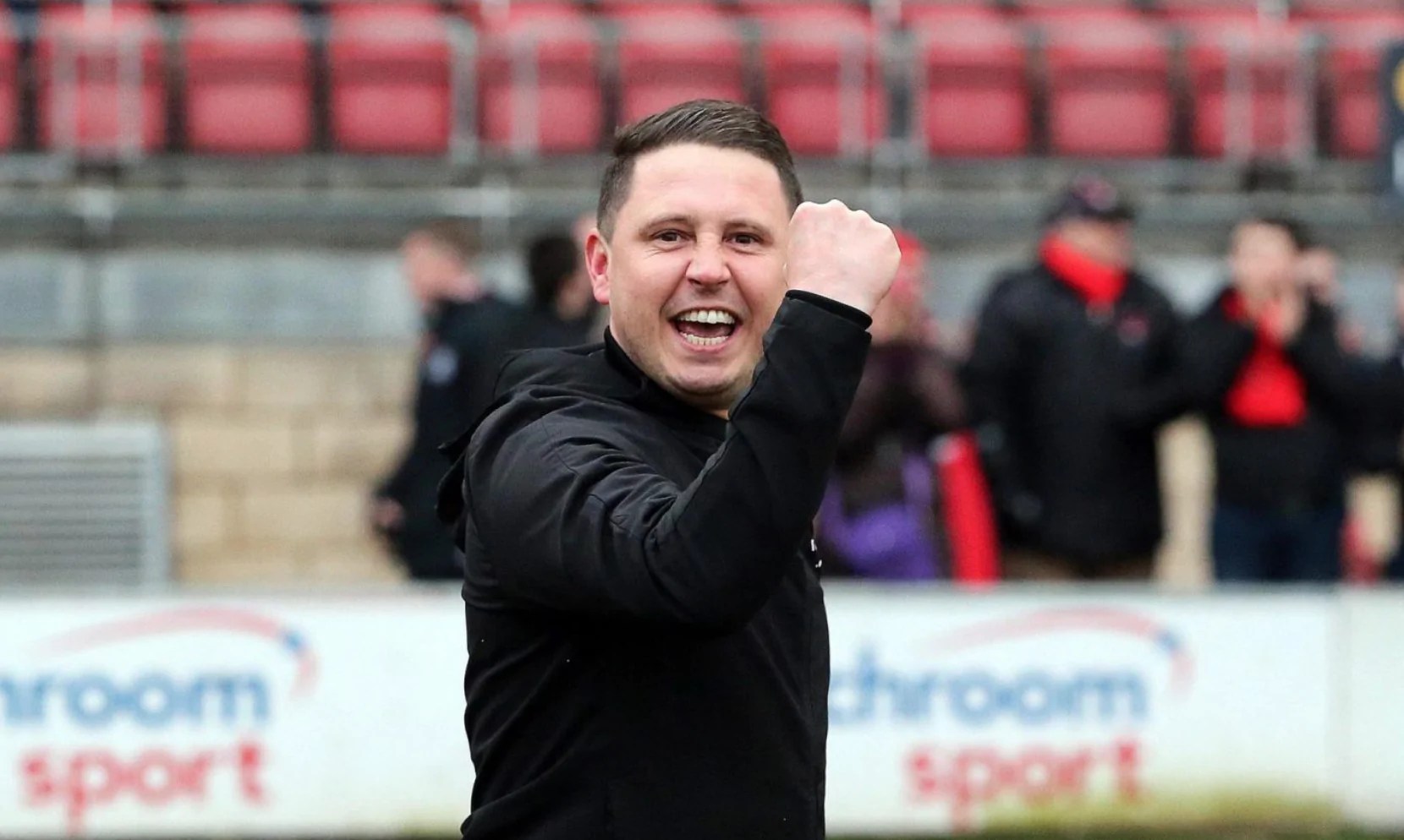 O's manager Ross Embleton celebrates victory over Cambridge Utd