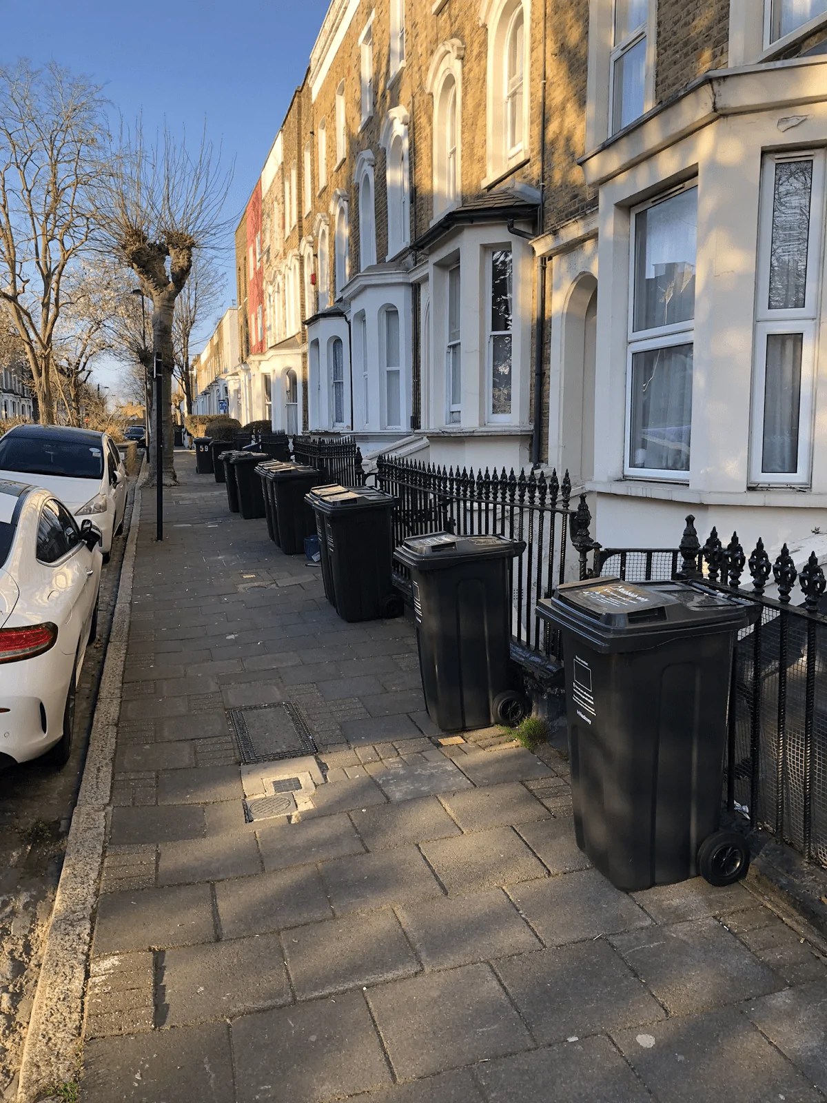 Old bins on street for reduced bin collection