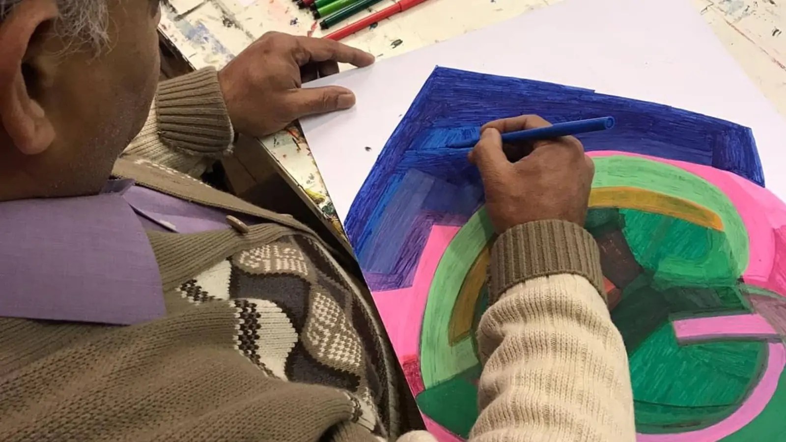 Member painting a picture at Headway East London