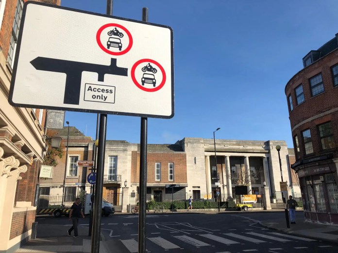 A photo of a bus gate sign.