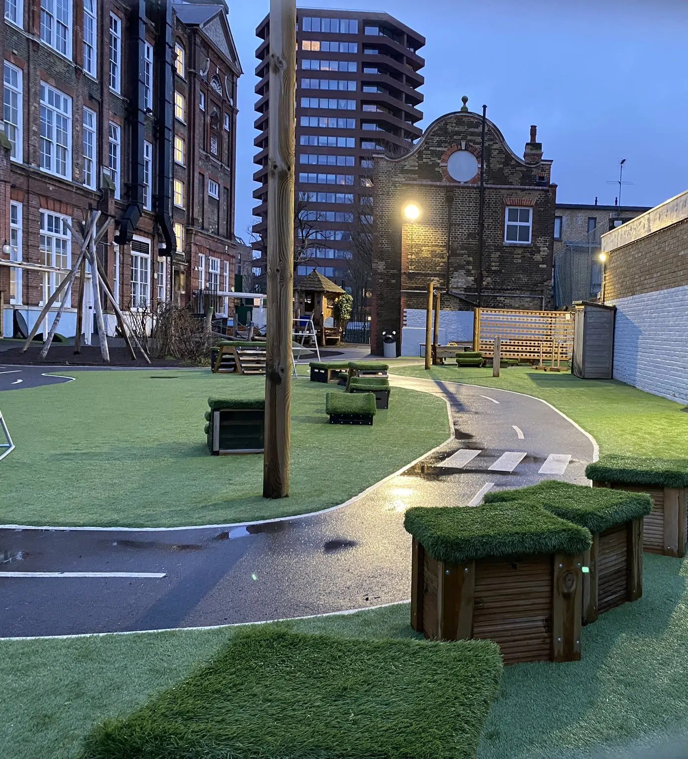 School play equipment covered by artificial turf