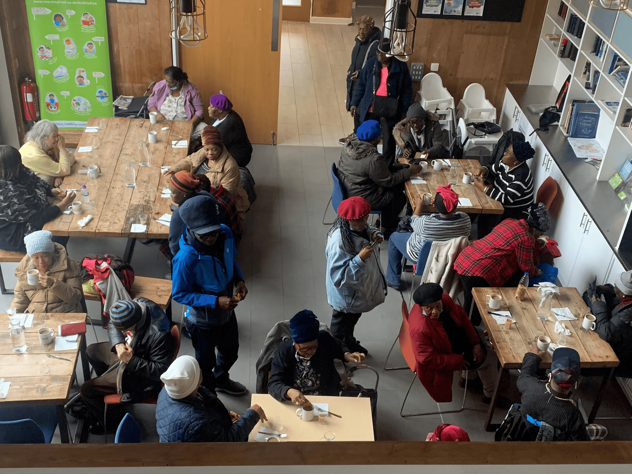 Elderly people enjoying tea and coffee at a lunch club