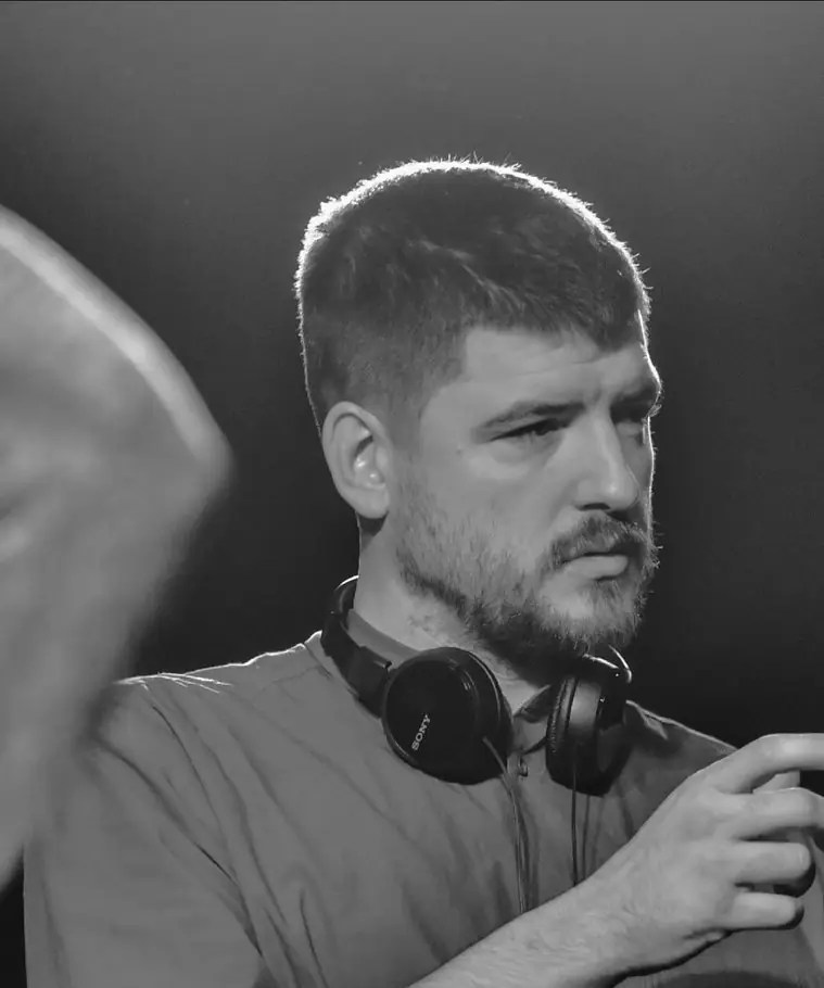 A picture of EastEnders actor James Alexandrou, in black-and-white.