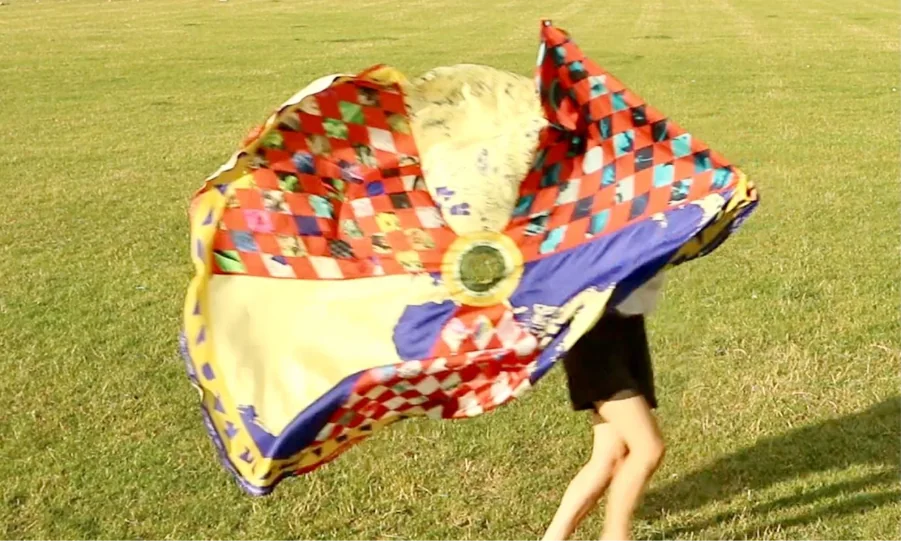 Image of multi-coloured fabric parachute on display