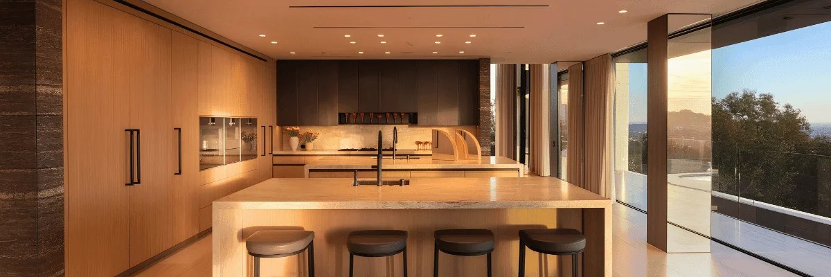 Close-up of natural stone countertop and ivory cabinetry in a luxury kitchen
