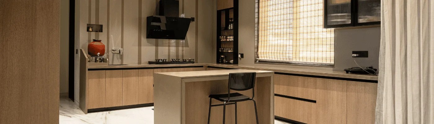 'Luxury modular kitchen with textured wood laminate shutters and marble flooring by Haeev, Hyderabad
