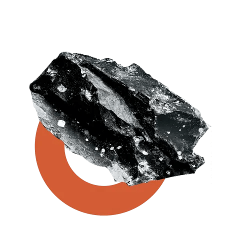 Fragmento de roca mineral sobre círculo naranja, representa materiales en economía circular