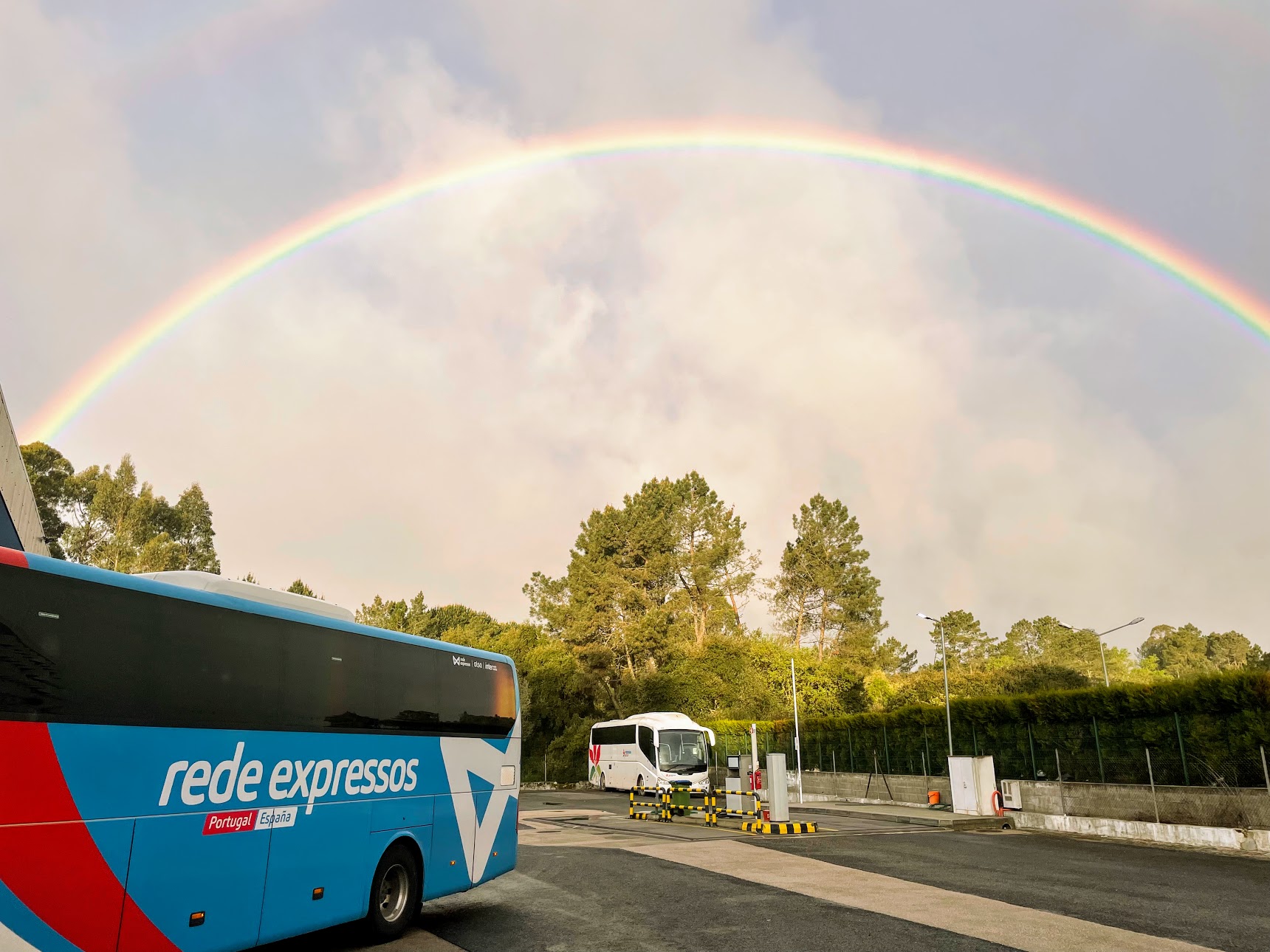 Rede Express bus at Fatima with a rainbow. 