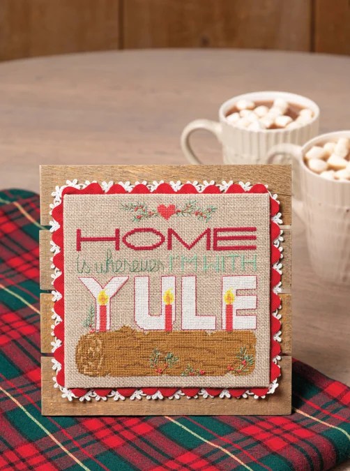 Home with Yule Christmas cross stitch pattern designed by Handmade with Chrissy, as seen in Just CrossStitch Magazine Christmas  2025 issue 