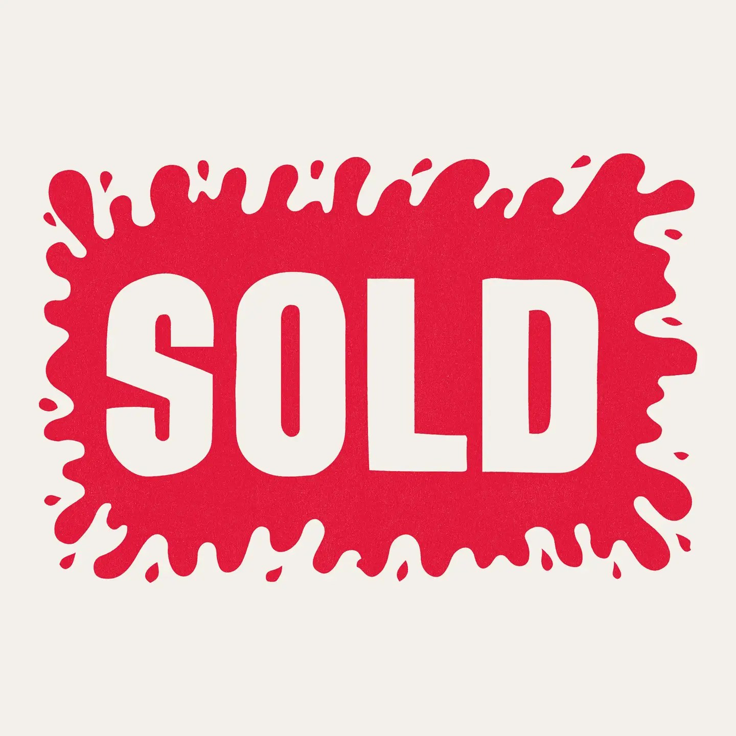 A vintage "SOLD" sign with a large "splat" of red color with the sold letters in white