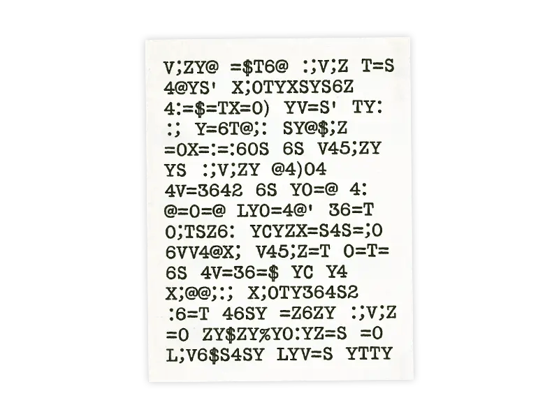 A vintage-looking sheet of paper covered in mysterious characters of an encoded secret message
