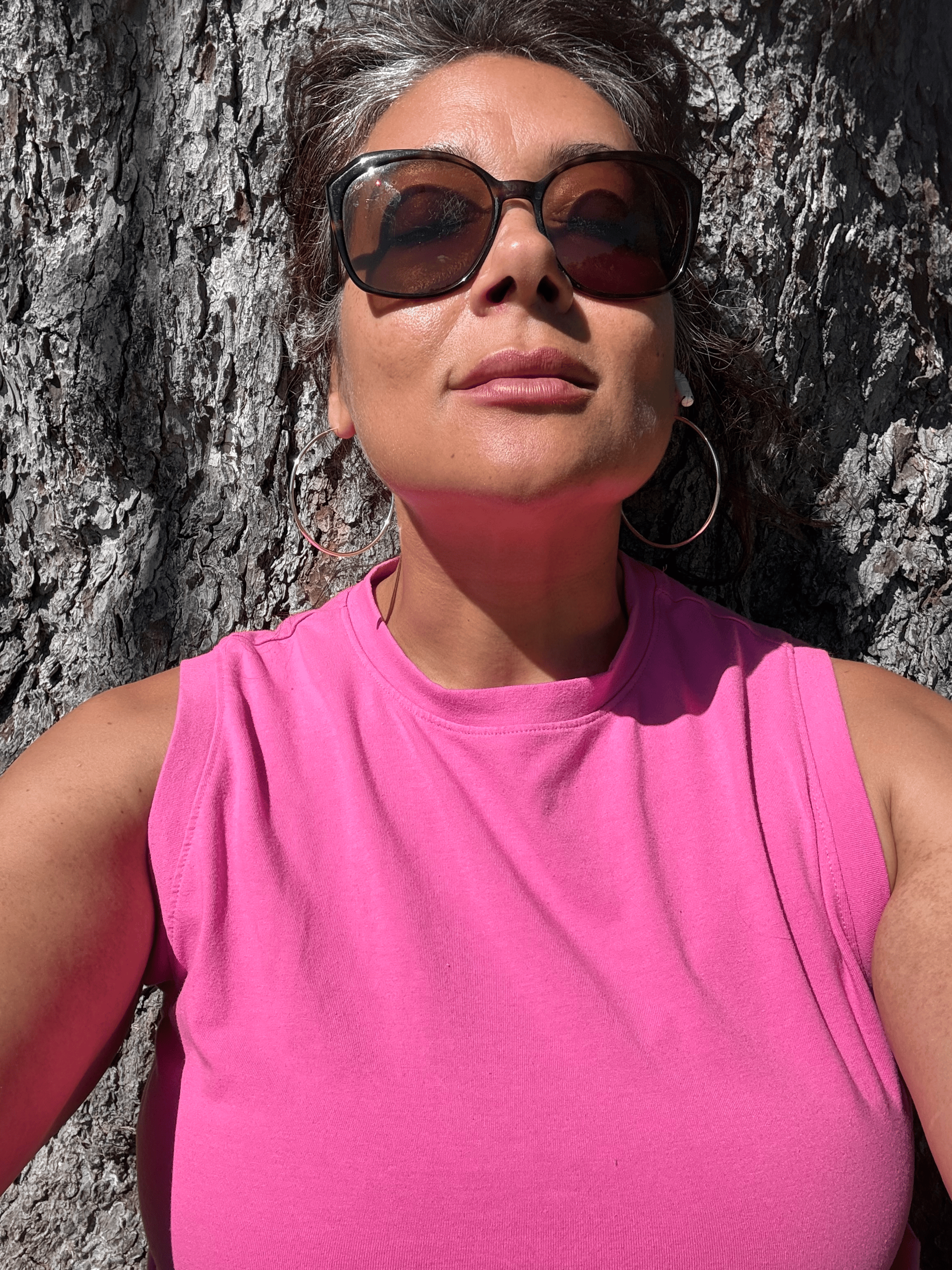 The Happy Bitch herself — sunglasses on, done pretending.