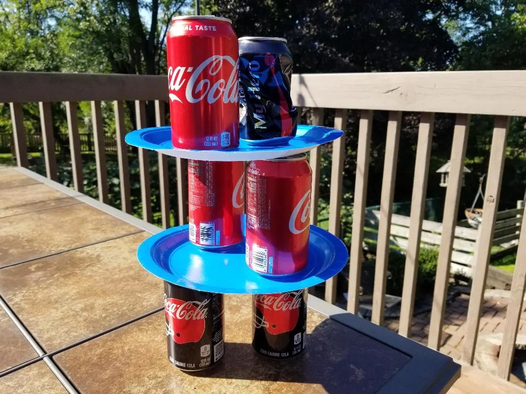 Minute to Win It Chandelier Game. Kids will love the challenge of creating a chandelier out of pop cans in 1 minute.
