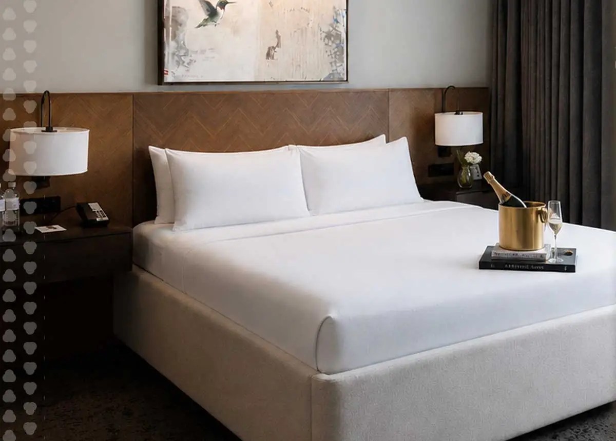 Harpeth King Corner Junior Suite bed with ice bucket and sparkling wine