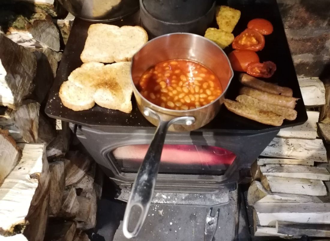 Revolutionary hippy cooks breakfast on woodburner Revolutionary hippy cooks breakfast on woodburner