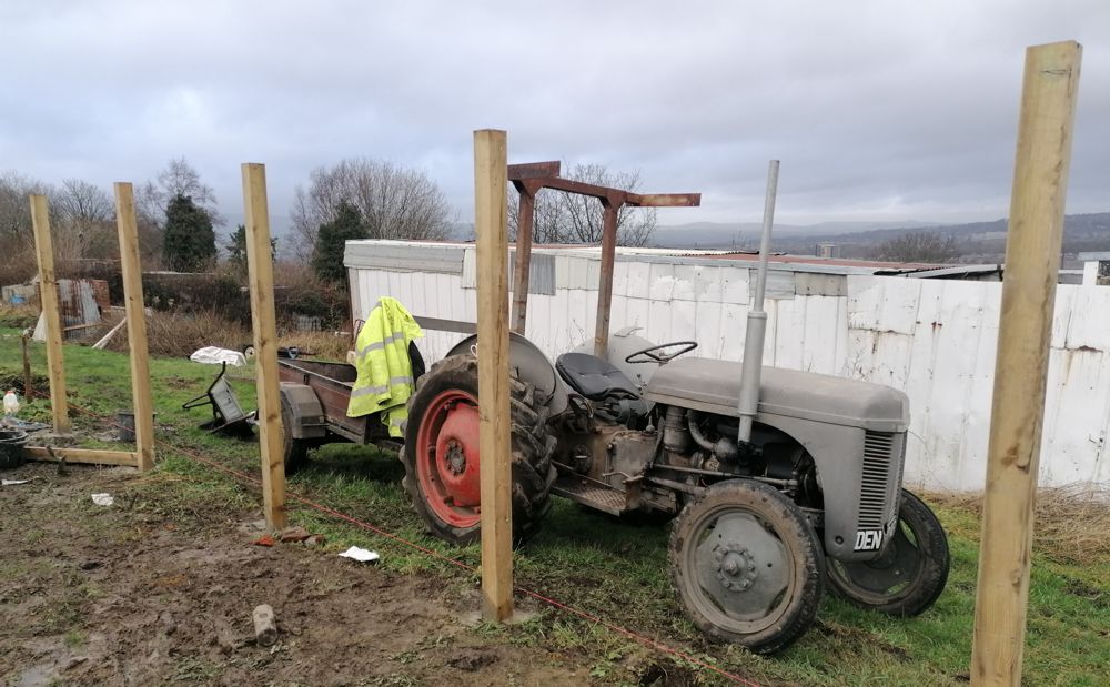 Tractor and greenhouse building action