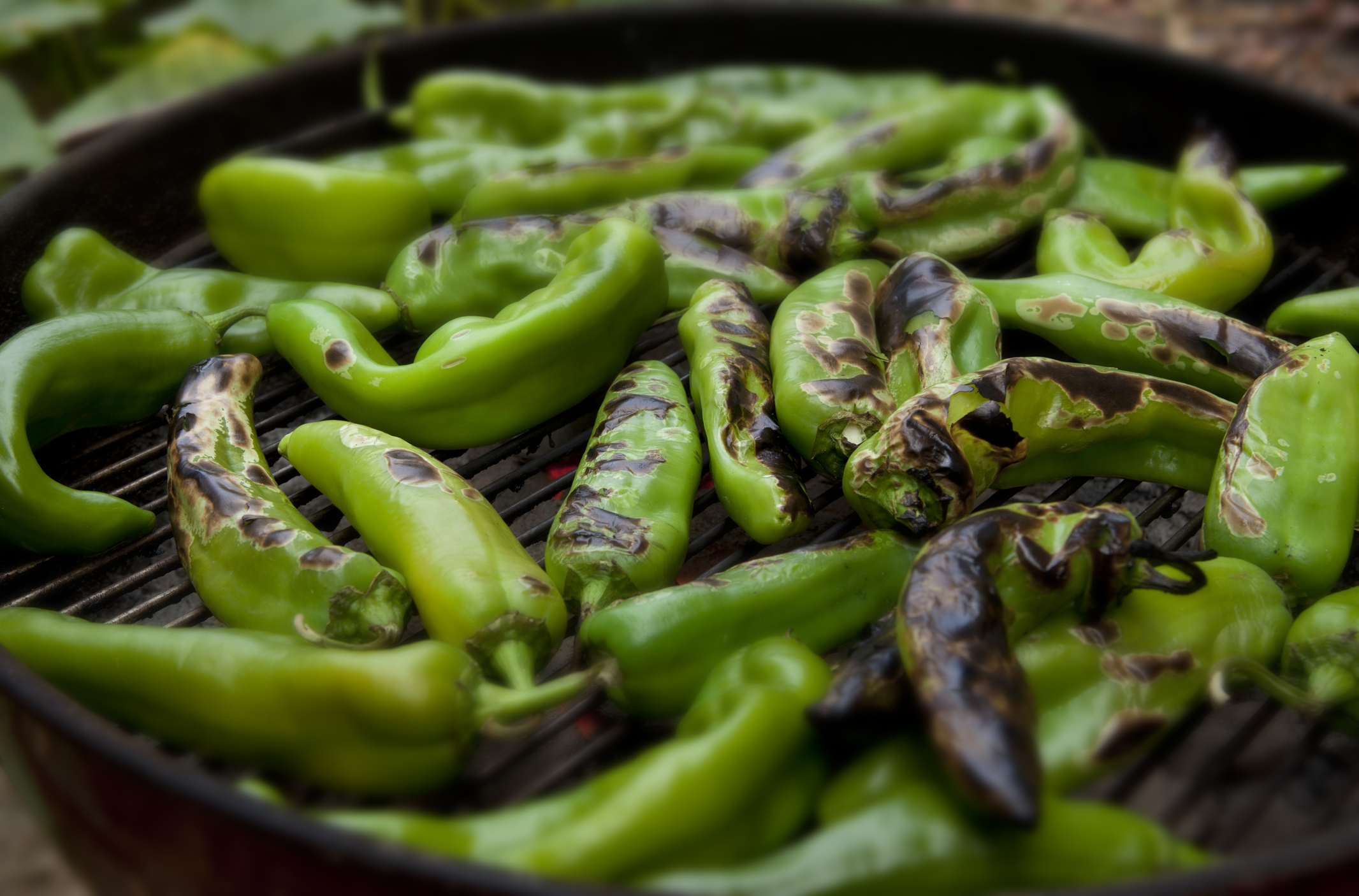 Hatch Chiles roasting over a fire