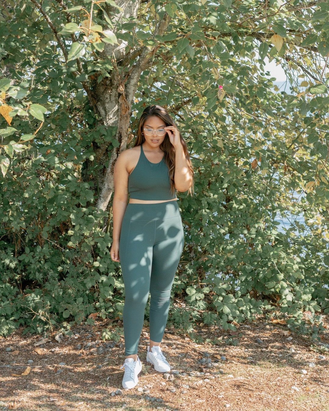 Compression tights with extra high waist from Girlfriend Collective in moss green color.