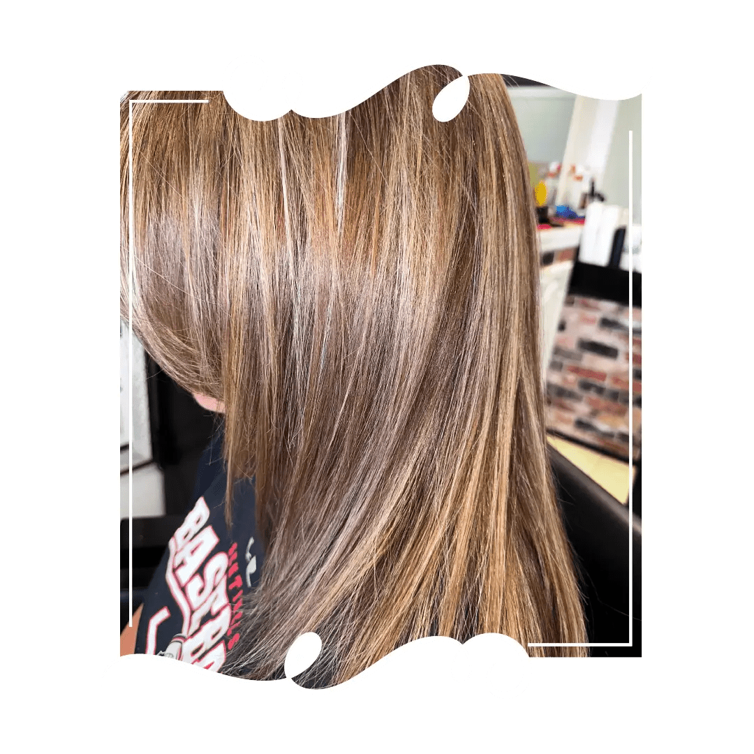 Chestnut brown with subtle highlights on straight layers at Havana Hair Salon in Cape Coral