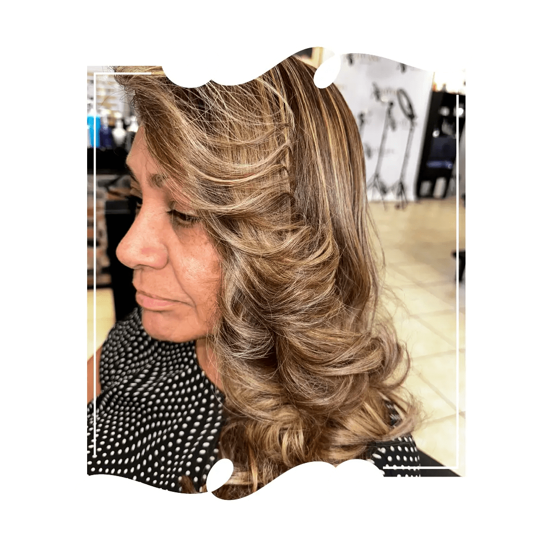 Warm brunette with golden highlights and face-framing layers at Havana Hair Salon in Cape Coral