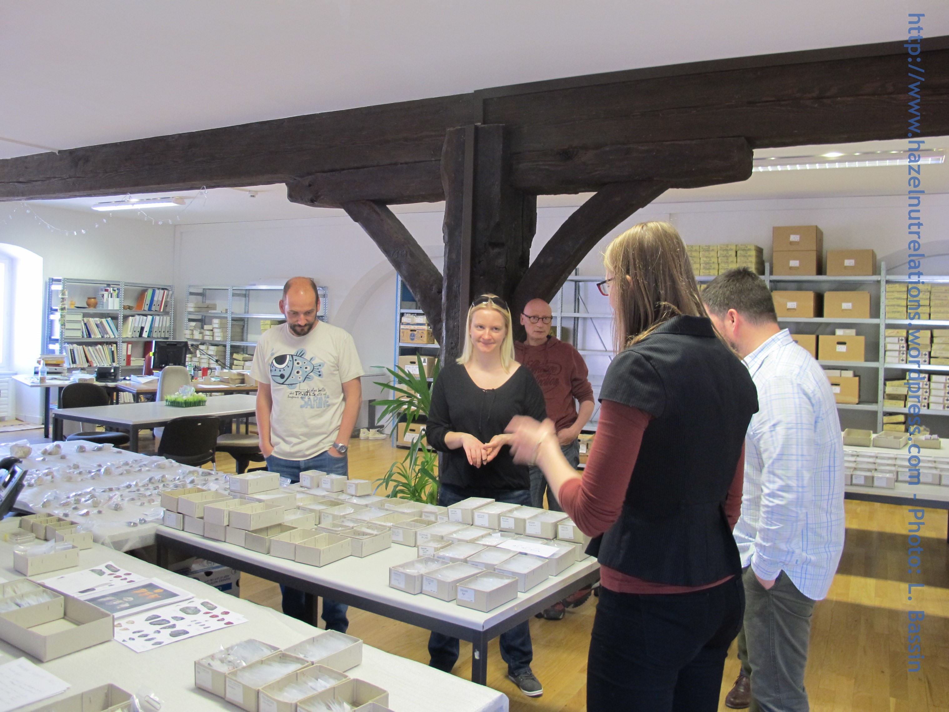 Laure Bassin (with her back to us, dark clothing) showing us her lithics. April 2015