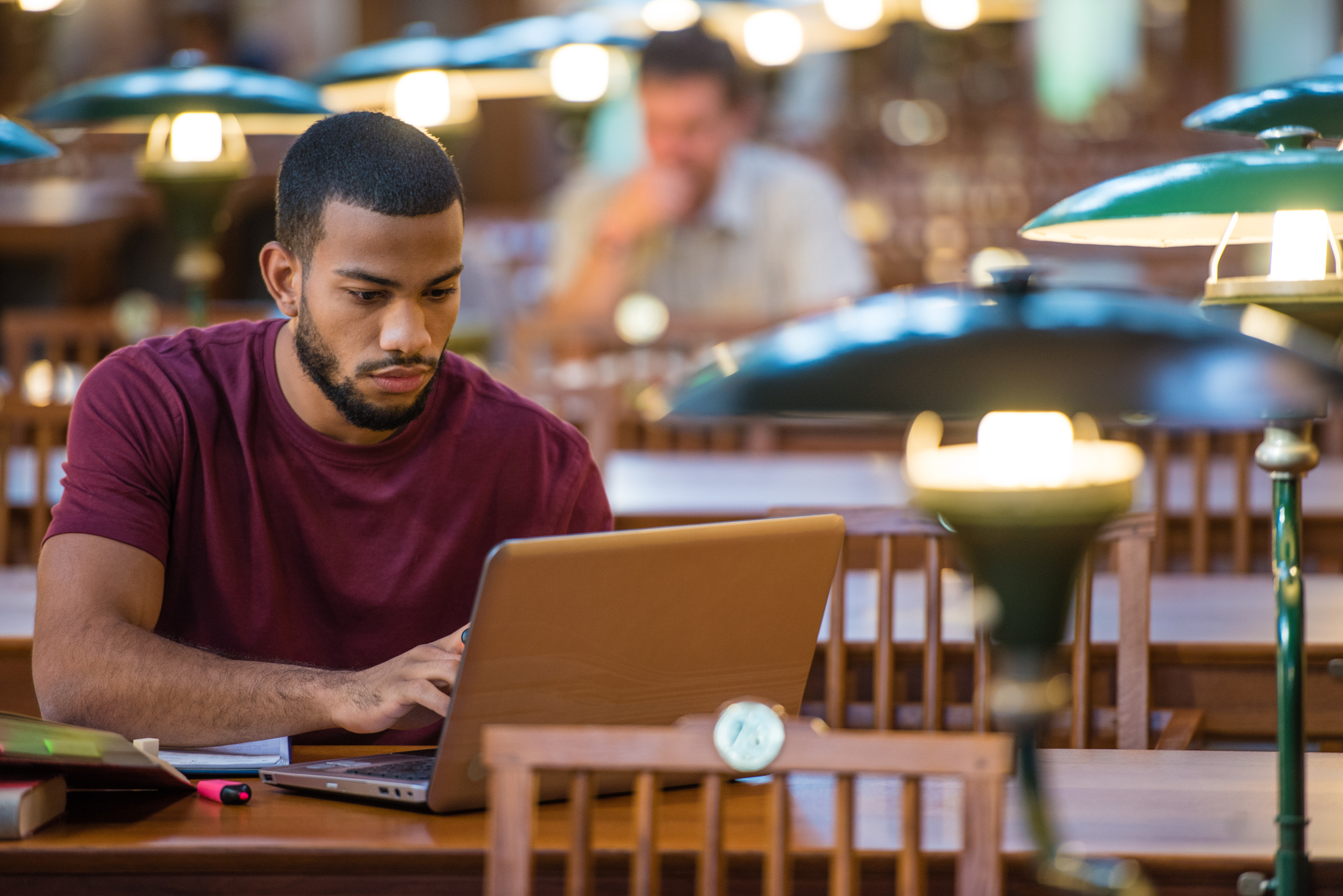 Students sitting in the library studying