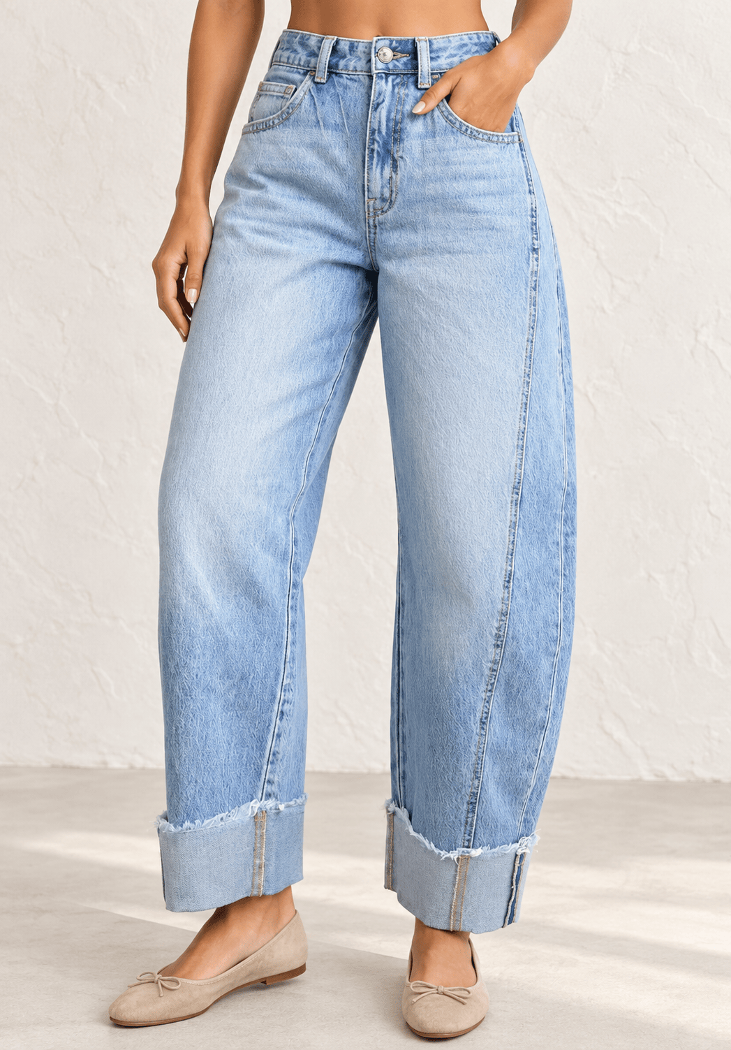The Rory Cuffed Denim Jeans in a light wash with relaxed ankle length and cuffed raw hem