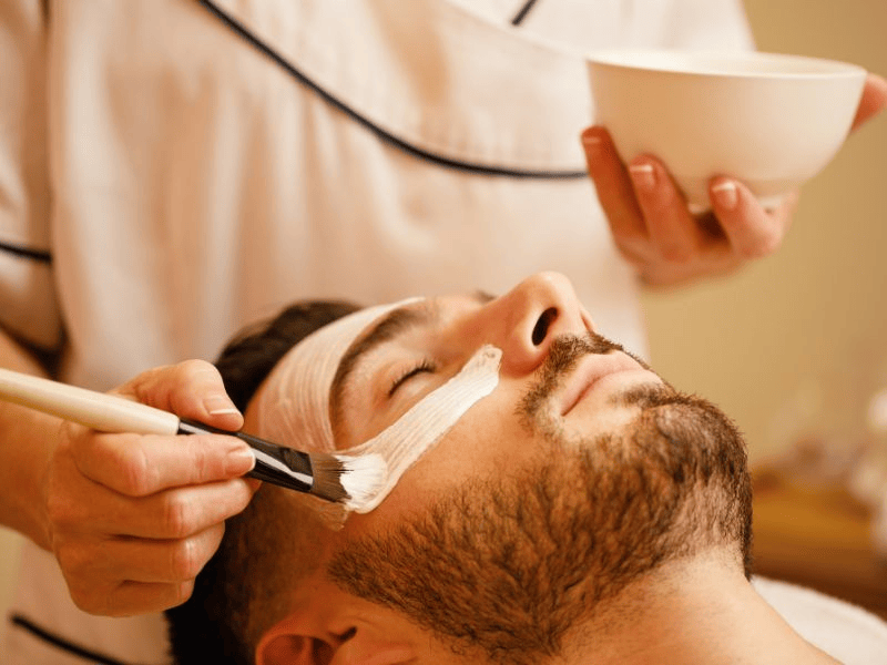 Men's facial treatment at a Nassau beauty spa