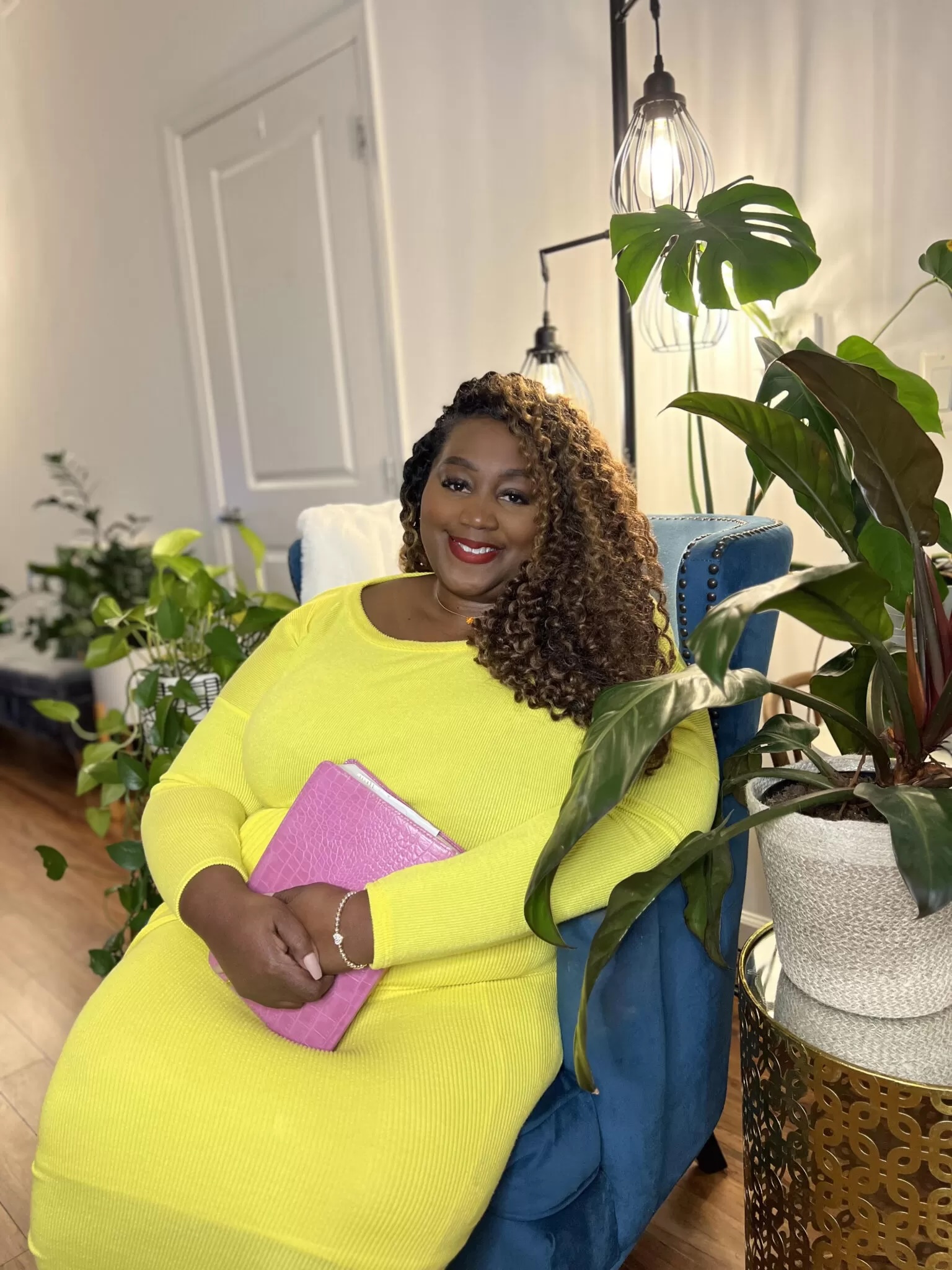 Yvette Perry Banks, founder of Haven & Light Comfort, holding her Bible — Healing Scriptures Blanket creator.