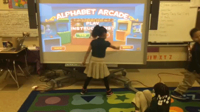 Kindergartners will soon get new iPads at the John F. Hartranft school in North Philadelphia. Until then, a small group of students takes turns playing a video game while their classmates work on four computers at the back of the room and the rest practice their reading with real books. (Video: Sarah Garland)
