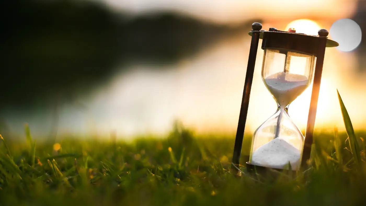 hourglass in grass