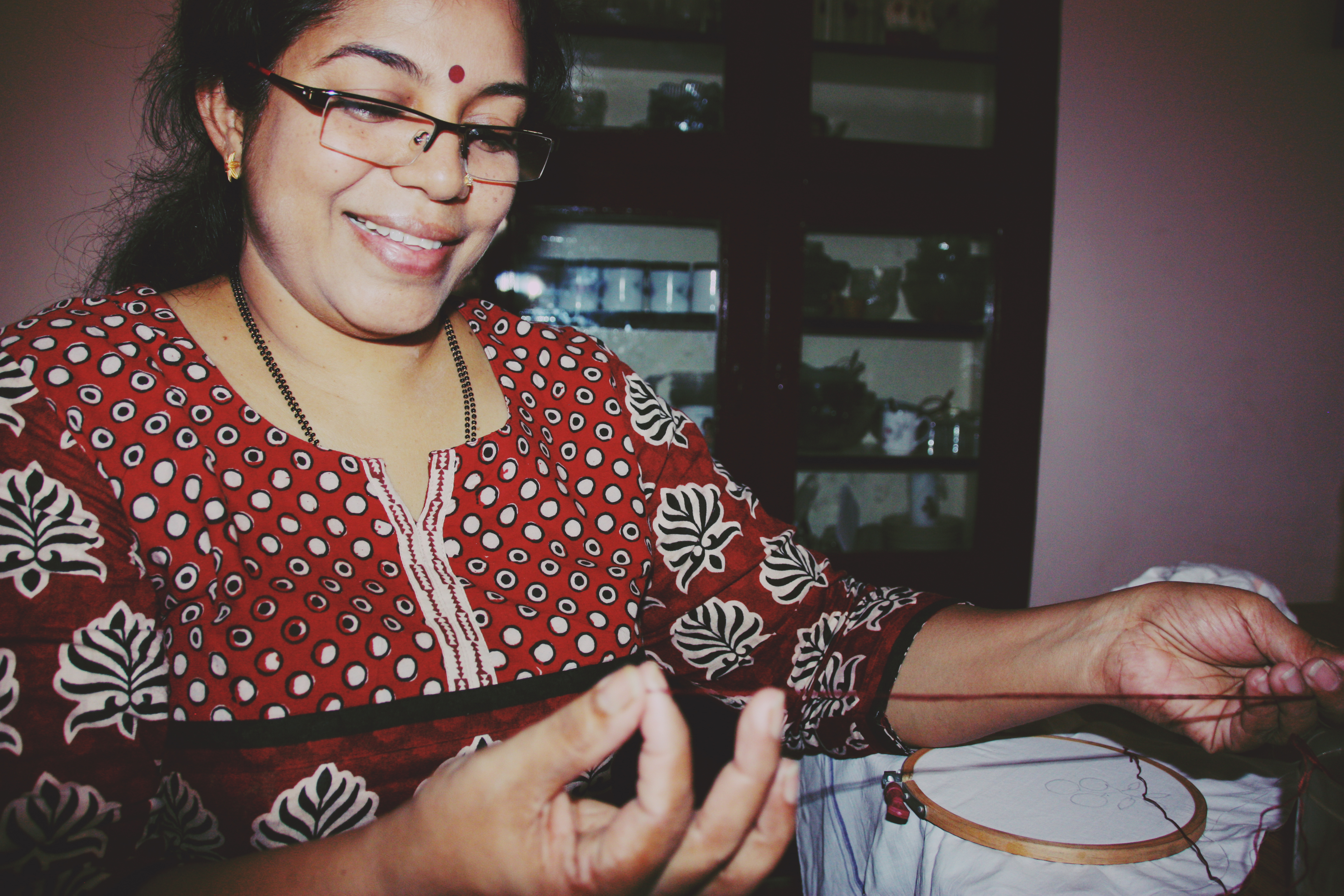 My aunt teaching me embroidary