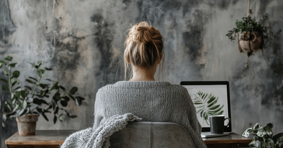 woman at desk struggling to find clarity in survival mode