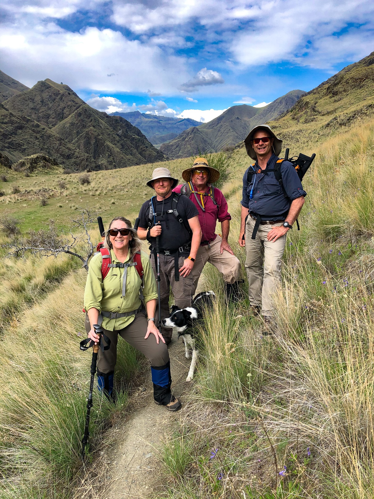 Four volunteers clearing trail