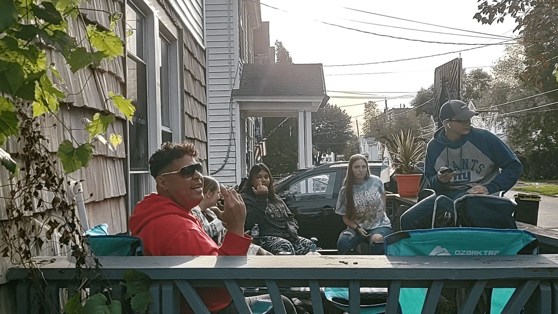 Jordan Bormann--far right, on porch railing. He's with his heckler friends.