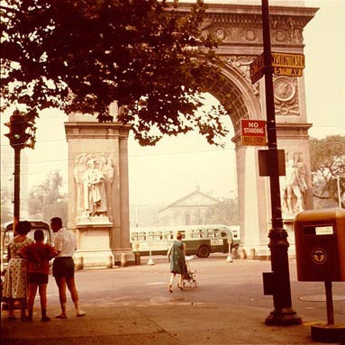 This older photo shows the Arch when traffic was still allowed in the Square.