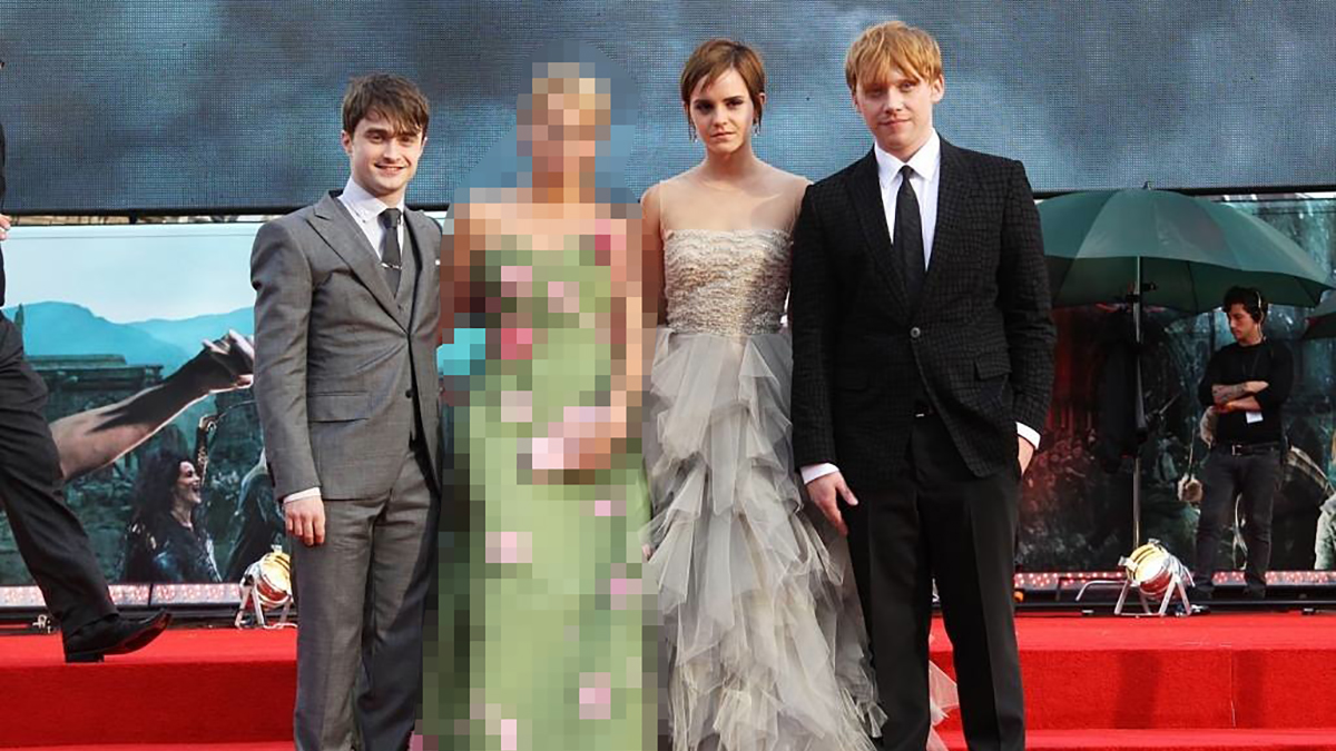 Daniel Radcliffe, a blurred figure, Emma Watson, and Rupert Grint at a Harry Potter premier
