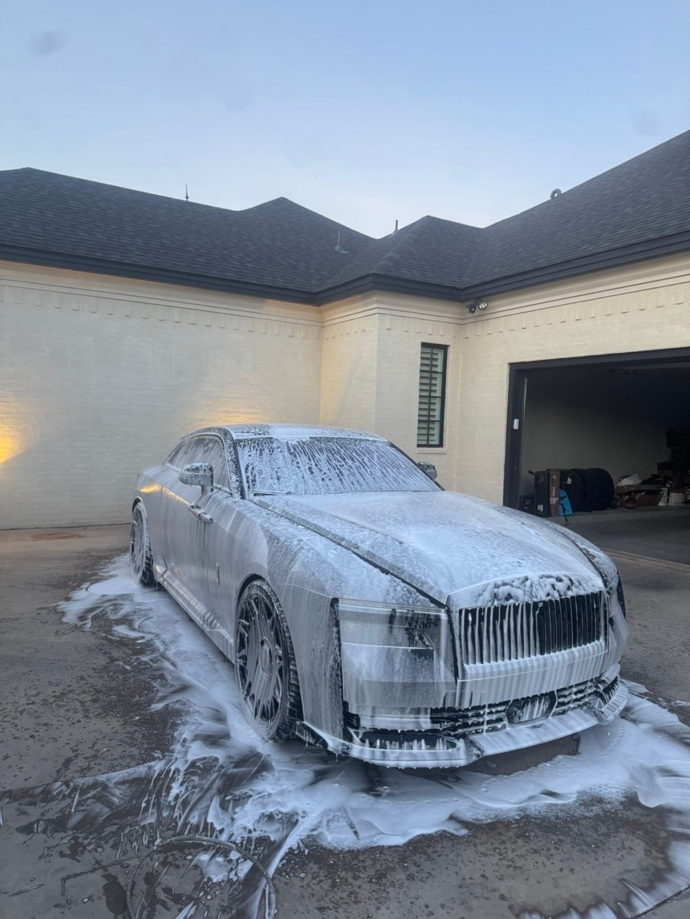 A High Line Details vehicle covered in foam during the wash stage