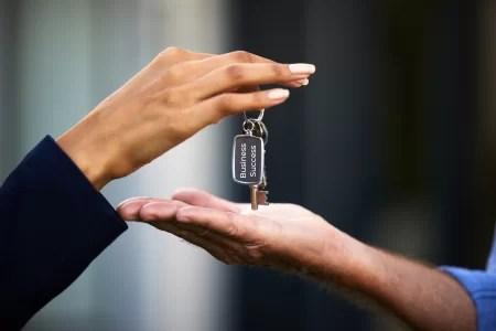 manager handing over the keys to new manager by accident