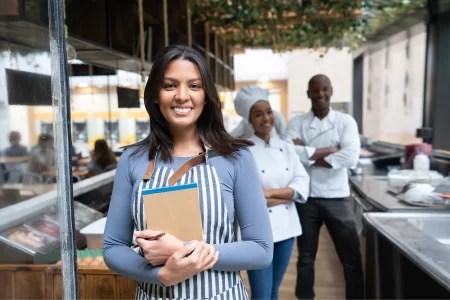restaurant manager in foreground.