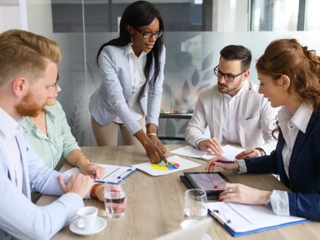 sales and marketing team discussing strategy